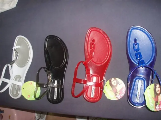 The picture consists of a table, on the table there are sandals. At the bottom there is a stool. On...