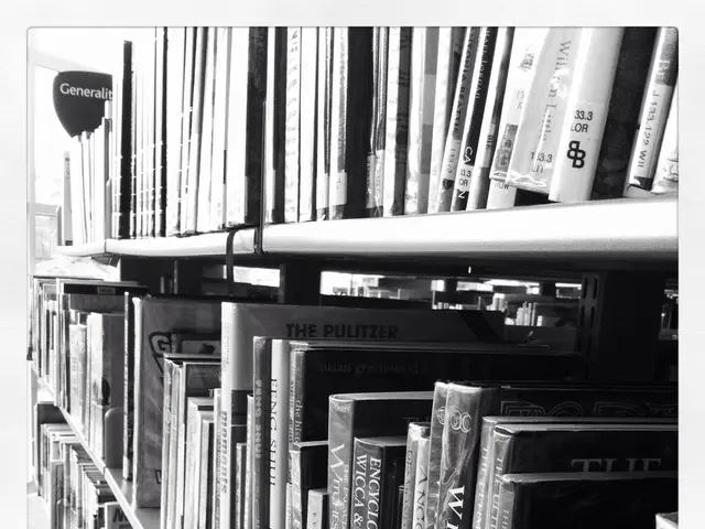 In this picture there is book shelf in the center of the image, which contains books in it.